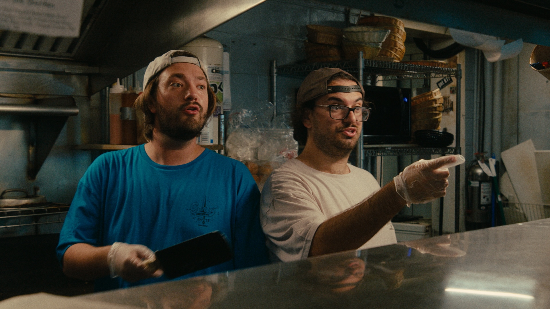 Two line cooks in the Gary's kitchen, mid-shift