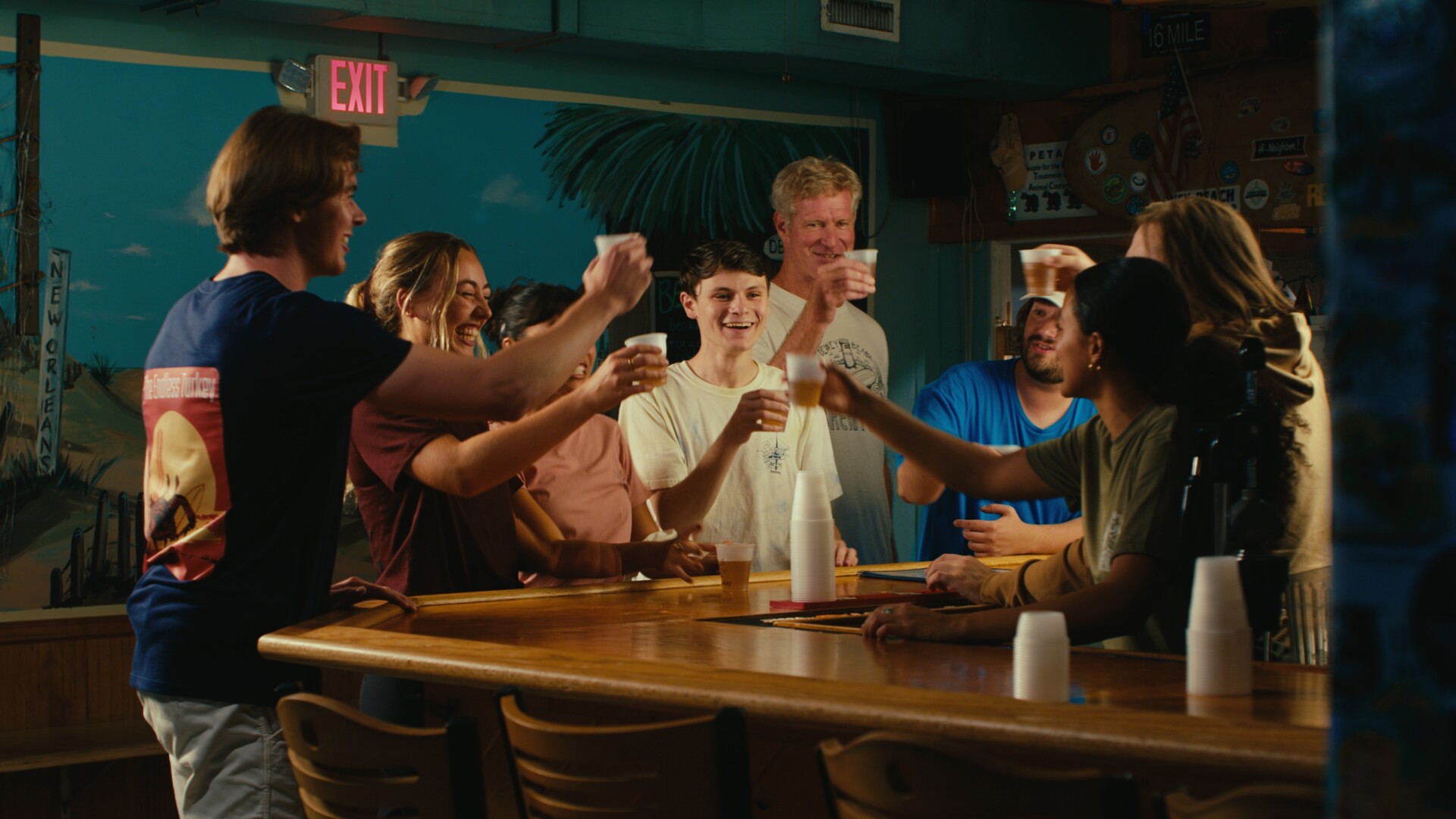 The Gary's Bar and Grill staff toasting behind the bar